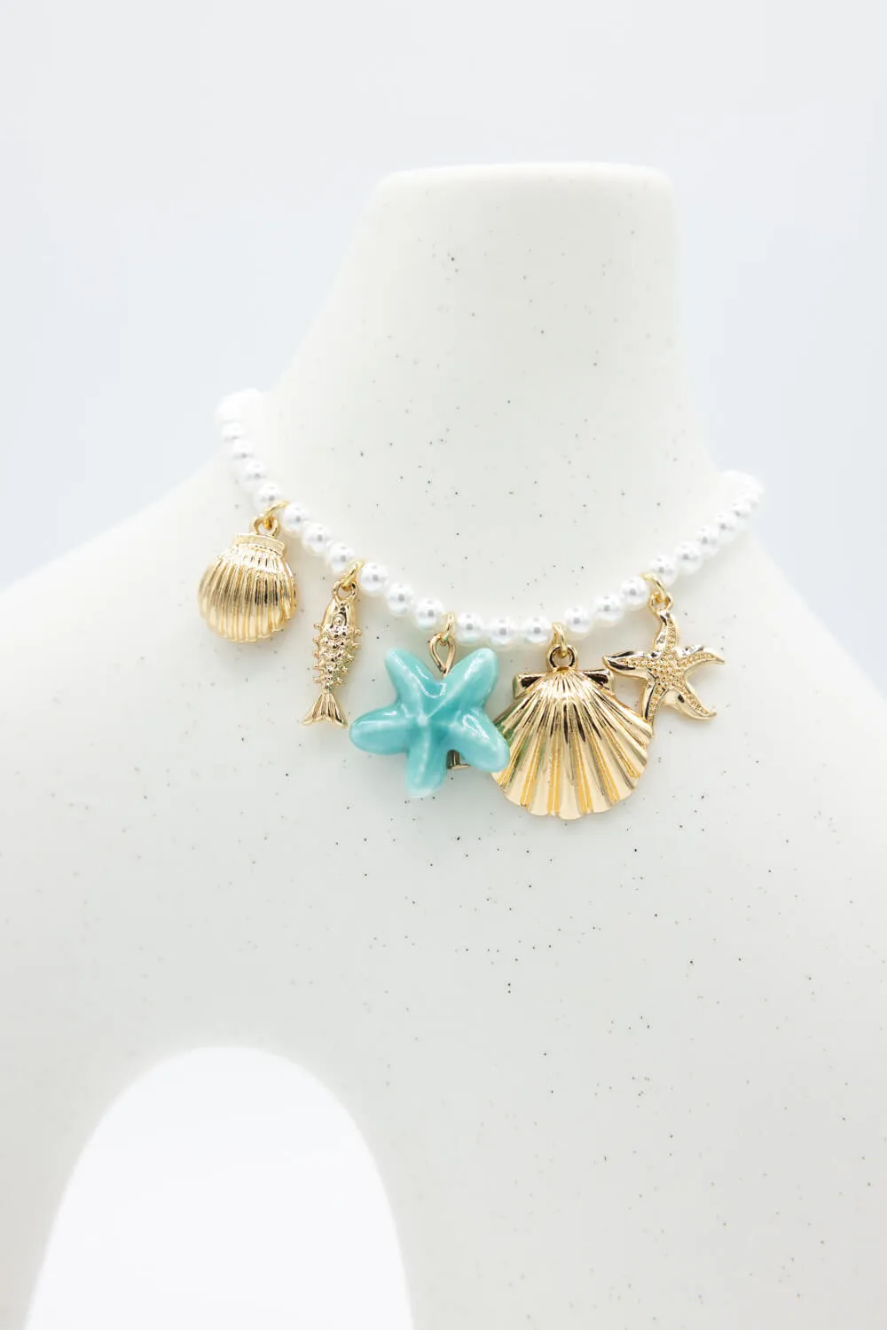 Sea Life Charm Pearl Bracelet in Gold | QBA478-GDBLE